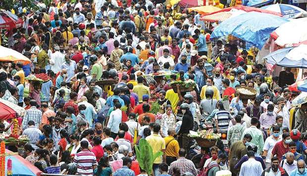 People crowd at the Dadar flower market in Mumbai yesterday.