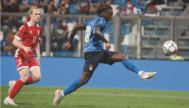 Italyu2019s Moise Kean (right) shoots to score during the World Cup UEFA Qualifiers match against Lithuania in Reggio Emilia, Italy, on Wednesday. (Reuters)