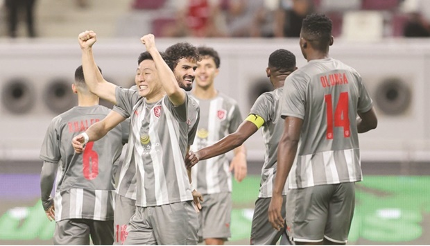 Al Duhailu2019s Nam Tae-hee celebrates after scoring against Al Arabi during the QNB Stars League match at the Khalifa International Stadium.