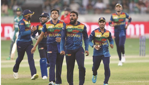 Sri Lankau2019s Wanindu Hasaranga (centre) celebrates after dismissing Pakistanu2019s Asif Ali (not pictured) during the Asia Cup Super Four match against Pakistan at the Dubai International Cricket Stadium in Dubai on Friday. (AFP)