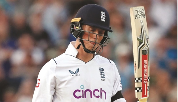 Englandu2019s Zak Crawley acknowledges the crowd as he celebrates after scoring a half-century on the fourth day of the third Test against South Africa at the Oval in London yesterday. (AFP)