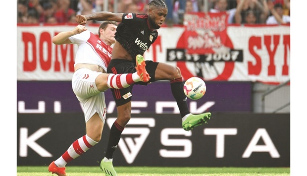 Cologneu2019s Luca Kilian (left) and Union Berlinu2019s Jordan Siebatcheu vie for the ball during the Bundesliga match yesterday. (AFP)