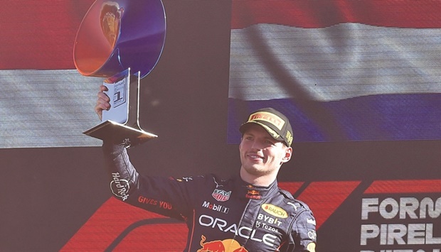 Red Bullu2019s Max Verstappen celebrates with the trophy after winning the Italian Grand Prix in Monza yesterday. (Reuters)