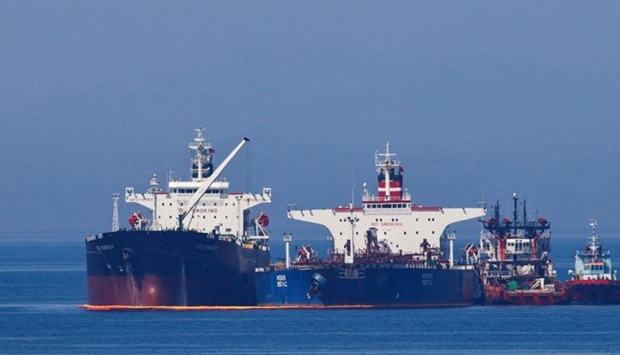The Liberian-flagged oil tanker Ice Energy transfers crude oil from the Iranian-flagged oil tanker Lana (former Pegas), off the shore of Karystos, on the Island of Evia, Greece, May 26, 2022. REUTERS
