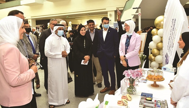 QU president Dr Hassan al-Derham, other dignitaries and officials at the event.