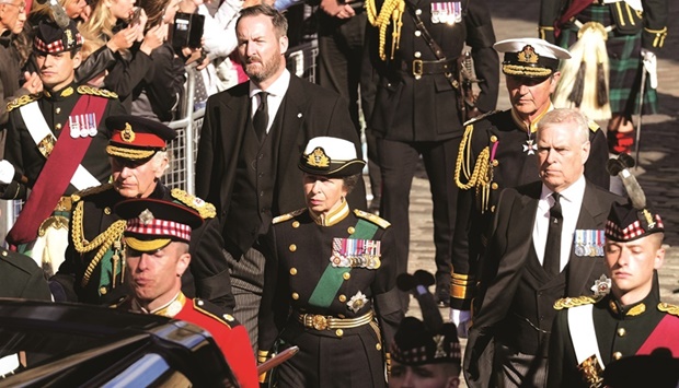 King Charles III, Princess Anne, and Prince Andrew, follow the coffin of Queen Elizabeth II up the Royal Mile to St Gilesu2019 Cathedral in Edinburgh, Scotland, yesterday.