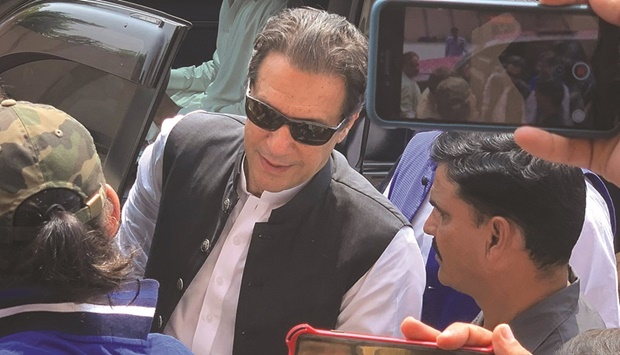 Pakistanu2019s former prime minister Imran Khan (centre) arrives to appear before the Anti-Terrorism Court in Islamabad yesterday.