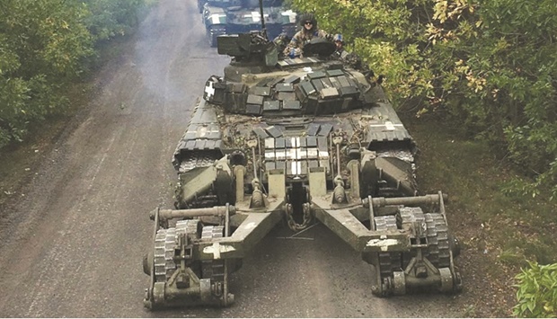 Helpers of the County Administrative Board in Stockholm County sit around tables as the final vote count begins yesterday at Nacka Expo Center in Stockholm one day after general elections. (AFP)