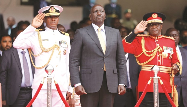 Kenyau2019s President William Ruto stands as the Kenyan national anthem is played during his swearing-in ceremony at Moi International Stadium in Nairobi, yesterday.