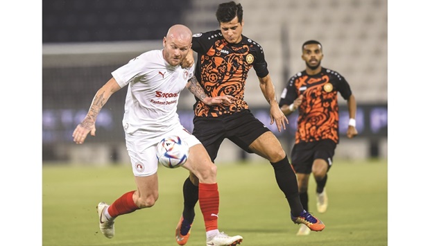 Umm Salalu2019s Joao Carlos Teixeira (right) and Al Arabiu2019s Aron Gunnarsson vie for the ball during the QNB Stars League match at the Jassim Bin Hamad Stadium on Tuesday. PICTURE: Noushad Thekkayil