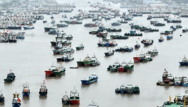 An aerial view shows vessels moored at a fishing port as Typhoon Muifa approaches, in Zhoushan, Zhejiang province, China on September 13. China Daily via REUTERS