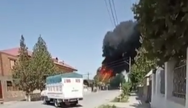 Smoke and fire billows after an explosion near Batken Airport, Kyrgyzstan.