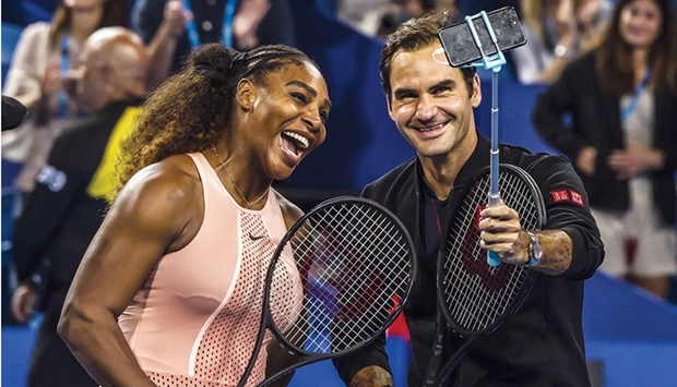 In this file photo taken on January 1, 2019, Serena Williams of the US and Roger Federer of Switzerland take a selfie following their mixed doubles match on day four of the Hopman Cup tennis tournament in Perth. (AFP)