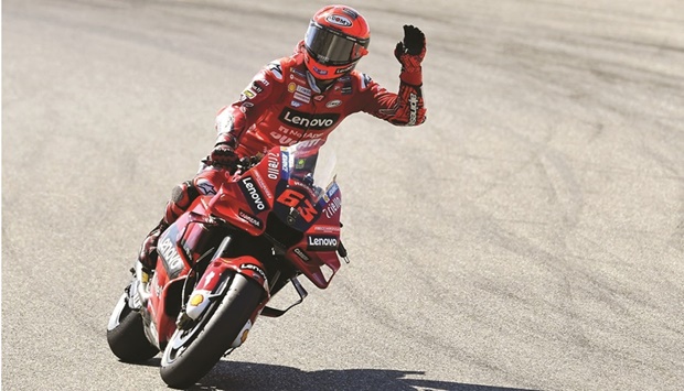 Ducatiu2019s Italian rider Francesco Bagnaia celebrates after getting the pole position for the Aragon Grand Prix at the Motorland Circuit in Alcaniz, Spain, yesterday. (AFP)