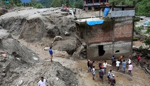 Nepalese officials said landslides triggered by monsoon rains buried several homes in Achham district, about 450 km west of the capital Kathmandu, leaving five people dead, 10 injured, and two missing.