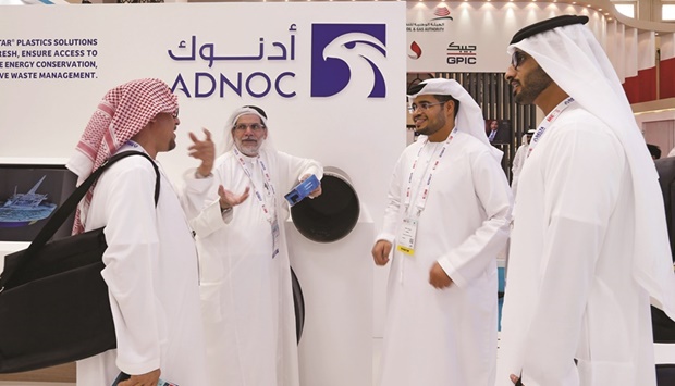 Visitors and guests are seen at the Adnoc stand during the 20th Middle East Oil & Gas Show and Conference (file). Abu Dhabi National Oil Co, which pumps almost all the UAEu2019s oil, wants to be able to produce 5mn barrels a day by 2025, according to people familiar with the matter.