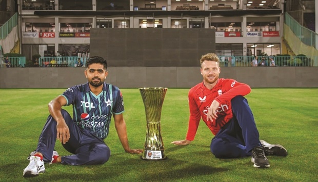 Pakistan captain Babar Azam (left) and his English counterpart Jos Buttler pose with the series trophy at the National Stadium in Karachi yesterday.