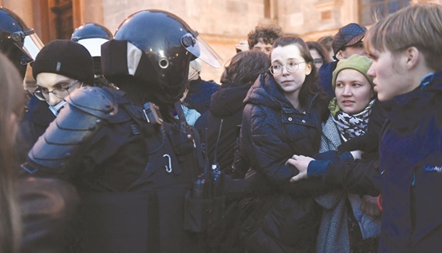 Police officers detain demonstrators in Saint Petersburg yesterday following calls to protest against partial mobilisation announced by President Vladimir Putin. (AFP)
