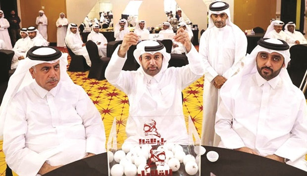 Dr Khalid bin Ibrahim al-Sulaiti showing results of the draw of Al Galayel Hunting Championship