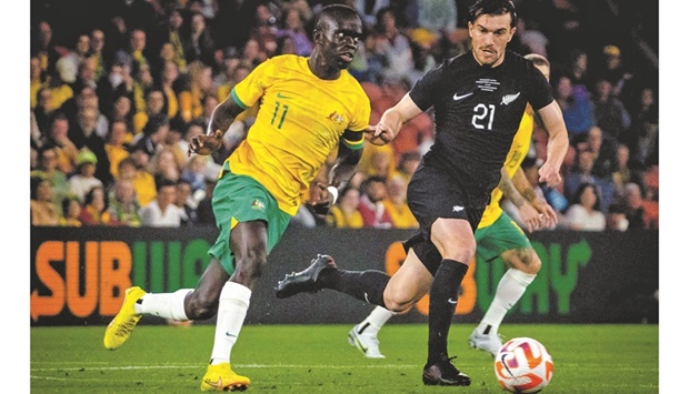 Australiau2019s Awer Mabil (left) and New Zealandu2019s Tim Payne compete during a friendly match against New Zealand at the Suncorp Stadium in Brisbane yesterday. (AFP)