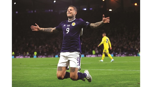 Scotlandu2019s Lyndon Dykes celebrates scoring their third goal during their Nations League match against Ukraine in Glasgow. (Reuters)