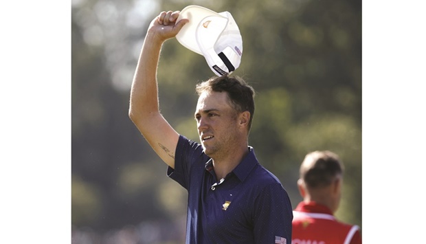 Team USAu2019s Justin Thomas acknowledges the crowd after winning 4&3 with teammate Jordan Spieth at Presidents Cup in Charlotte, North Carolina. (AFP)