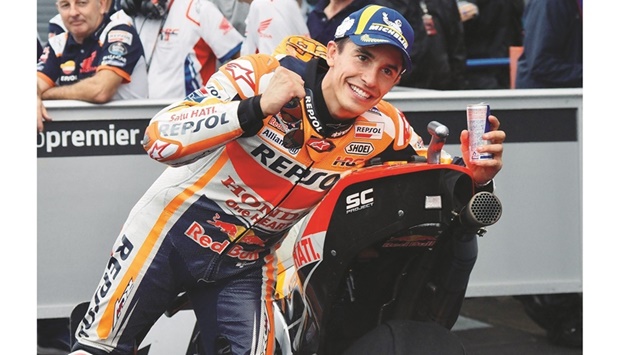 Repsol Honda Team rider Marc Marquez of Spain celebrates his pole position at the MotoGP Japanese Grand Prix at the Mobility Resort Motegi in Motegi yesterday. (AFP)