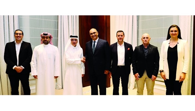Qatar Tourism chairman and Qatar Airways Group chief executive HE Akbar al-Baker shaking hands with Sahl Dudin, managing director of Ayla Oasis Development, in the presence of other dignitaries and officials.