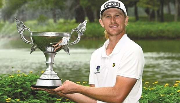 Travis Smyth of Australia posing with the winneru2019s trophy during round four of the Yeangder TPC at the Linkou International Golf and Country Club in New Taipei City. (AFP)