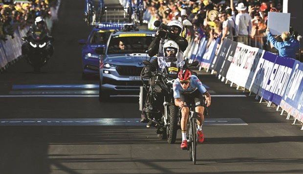 Belgiumu2019s Remco Evenepoel wins the menu2019s gold medal at the UCI 2022 Road World Championship in Wollongong yesterday. (AFP)