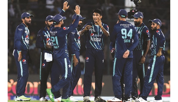 Pakistanu2019s players celebrate after the dismissal of Englandu2019s Will Jacks (not pictured) during the fourth Twenty20 international at the National Cricket Stadium in Karachi yesterday. (AFP)