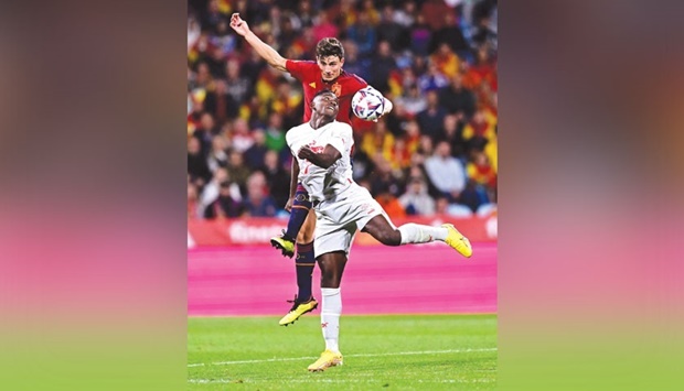 Spainu2019s defender Pau Torres (back) vies with Switzerlandu2019s forward Breel Embolo during the UEFA Nations League match at the La Romareda Stadium in Zaragoza yesterday. (AFP)