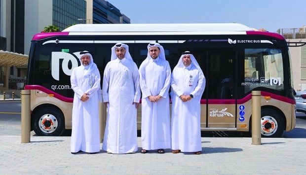 Officials mark the introduction of the new electric buses.