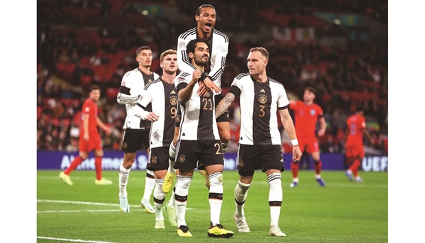 Germanyu2019s Ilkay Gundogan (front centre) celebrates with teammates after scoring against England in the UEFA Nations League. (Reuters)