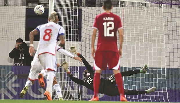 Qataru2019s goalkeeper Meshaal Barsham saves a penalty kick off Chileu2019s Alexis Sanchez during the international friendly at the Franz Horr Stadium in Vienna yesterday. (AFP)
