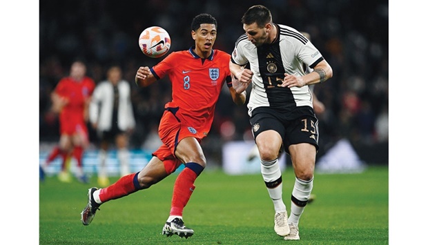 Germanyu2019s Niklas Sule (right) and Englandu2019s Jude Bellingham vie for the ball during the UEFA Nations League  Group C match at the Wembley Stadium in London on Monday night. (Reuters)