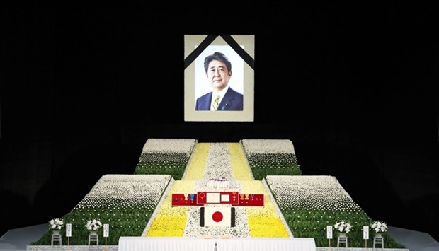 A portrait of Shinzo Abe hangs above the stage during the state funeral for Japan's former prime minister Shinzo Abe at the Budokan in Tokyo, Japan. REUTERS