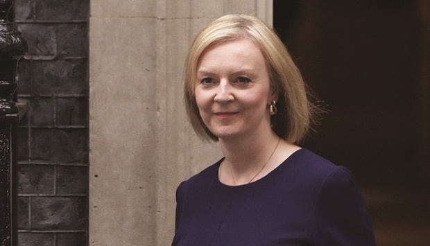 Britainu2019s Prime Minister Liz Truss walks outside Downing Street in London on September 23. A day after the Bank of England resumed its bond-buying in an emergency move to protect pension funds from partial collapse, Truss blamed the upheaval on Russiau2019s invasion of Ukraine that has caused inflation to spike around the world.