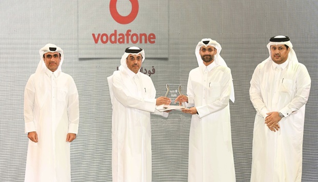 HE the Minister of Labour Dr Ali bin Saeed bin Smaikh al-Marri honouring Vodafone Qatar.