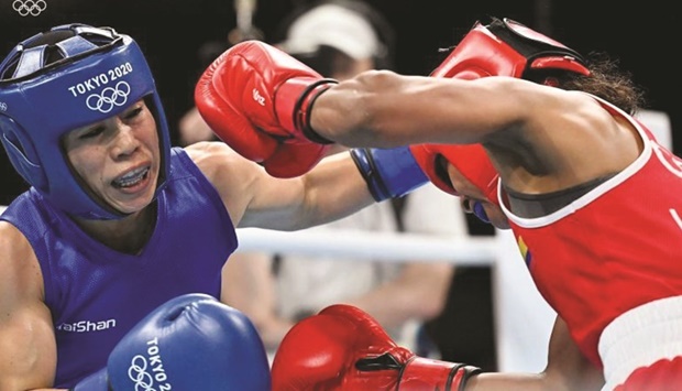 Indian Boxer MC Mary Kom (left) is seen in action against Colombiau2019s Ingrit Valencia in the Tokyo Olympics last year.