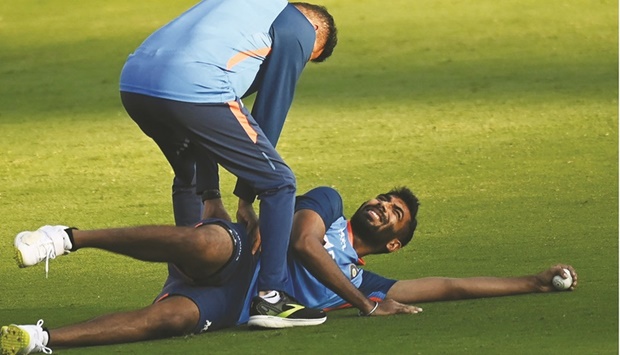 Indiau2019s Jasprit Bumrah stretches during a practice session on the eve of the first Twenty20 match against South Africa at the Greenfield International Stadium in Thiruvananthapuram on Tuesday. (AFP)