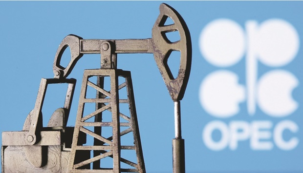 A 3D-printed oil pump jack is seen in front of the Opec logo in an illustration picture. Opec oil output rose in September to its highest since 2020, surpassing a pledged hike for the month, after production in Libya recovered from disruption and Gulf members boosted output under a deal with allies, a Reuters survey found yesterday.