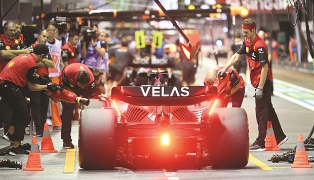 Ferrariu2019s Spanish driver Carlos Sainz Jr stops in the pit lane during a practice session for the Formula One Singapore Grand Prix night race at the Marina Bay Street Circuit in Singapore yesterday. (AFP)