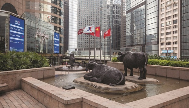 Sculptures stand outside the Hong Kong Stock Exchange. The Hang Seng Index closed down 1.8% to 19,109.68 points yesterday.