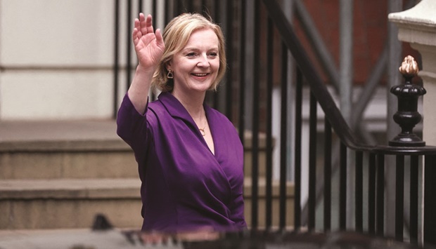 Liz Truss gestures outside the Conservative Party headquarters, after being announced as Britainu2019s next prime minister, in London, Britain, yesterday.