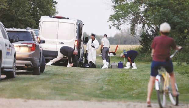 A police forensics team investigates a crime scene after multiple people were killed and injured in a stabbing spree in Weldon, Saskatchewan, Canada. (Reuters)