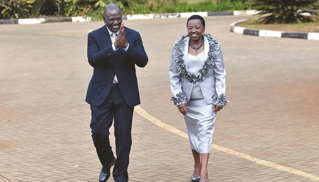 President elect William Ruto, accompanied by wife Rachel, head to give a press conference at his official residence following a Supreme Court ruling on the contested outcome of Kenyau2019s presidential election in Nairobi yesterday. (AFP)