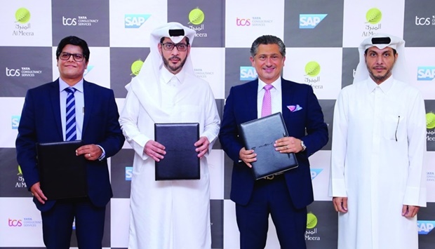 Al Meera CEO Yousef Ali al-Obaidan and Abdulaziz Almana, Al Meera IT director, are joined by Alaa Jaber, managing director for SAP Qatar and Fast Growth Markets, and Devashis Goswamy, country head, TCS Qatar, at the agreement signing ceremony in Al Meerau2019s head office in Doha.