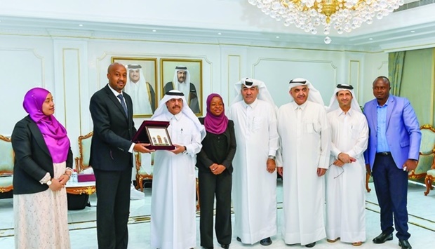 Qatar Chamber assistant director general for Government Relations and Committees Affairs Ali Bu Sherbak al-Mansouri and Professor Eliamani Sedoyeka, permanent secretary, Ministry of Natural Resources and Tourism, alongside other officials during a meeting held at the chamber's Doha headquarters.