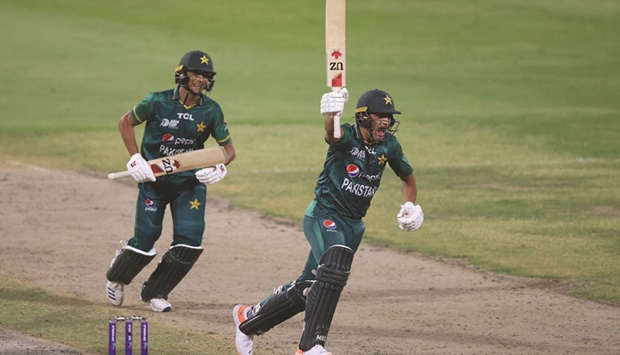 Pakistanu2019s Naseem Shah (right) celebrates after hitting a boundary to win the Asia Cup Twenty20 international match against Afghanistan at the Sharjah Cricket Stadium in Sharjah yesterday. (AFP)